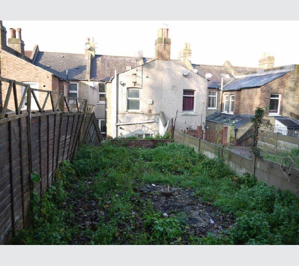 A Freehold Mid Terrace House (Shell Condition) with Garden