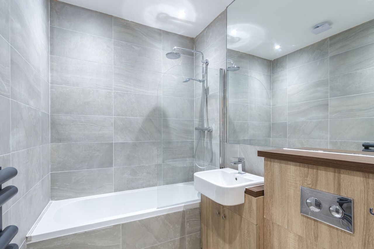 INVESTMENT -  Long Leasehold Well Located Lower Ground Floor Garden Flat  