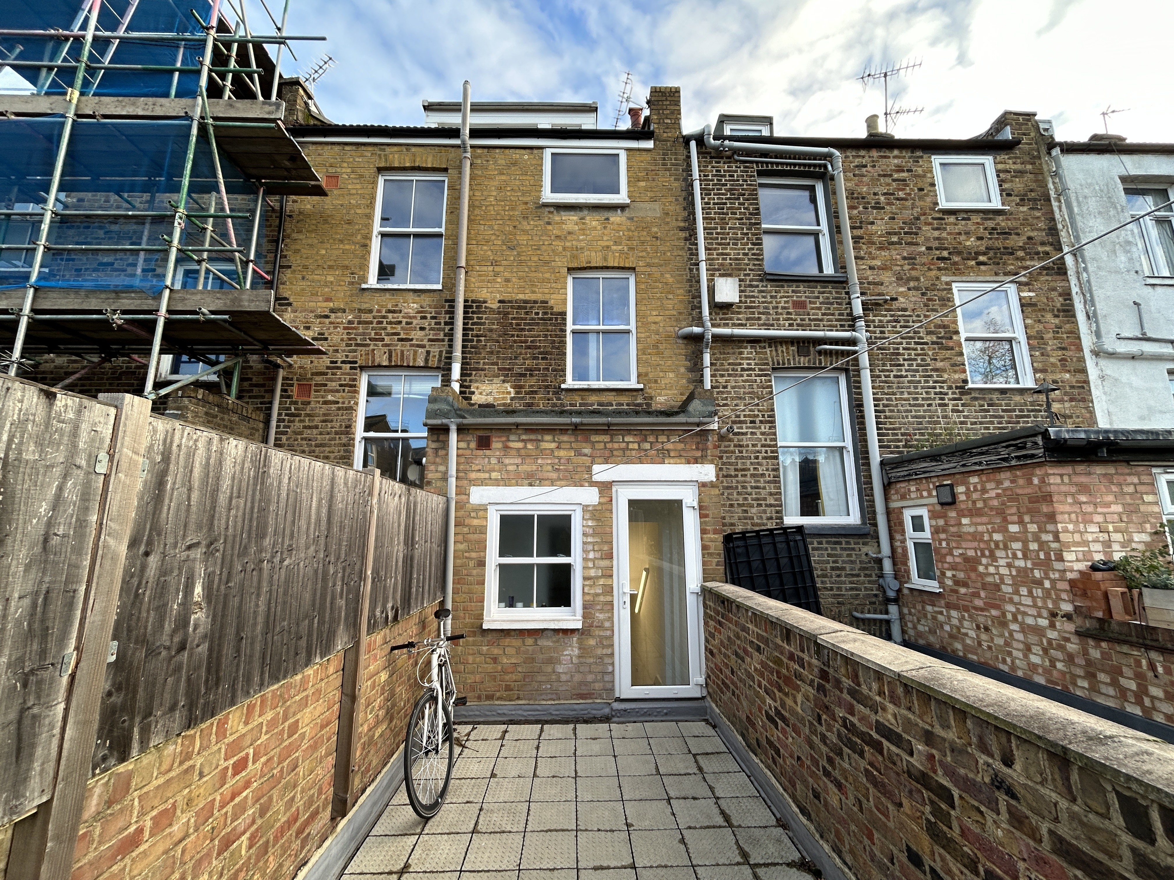INVESTMENT - Well Located Leasehold Self Contained Four Bedroom Split-Level Flat