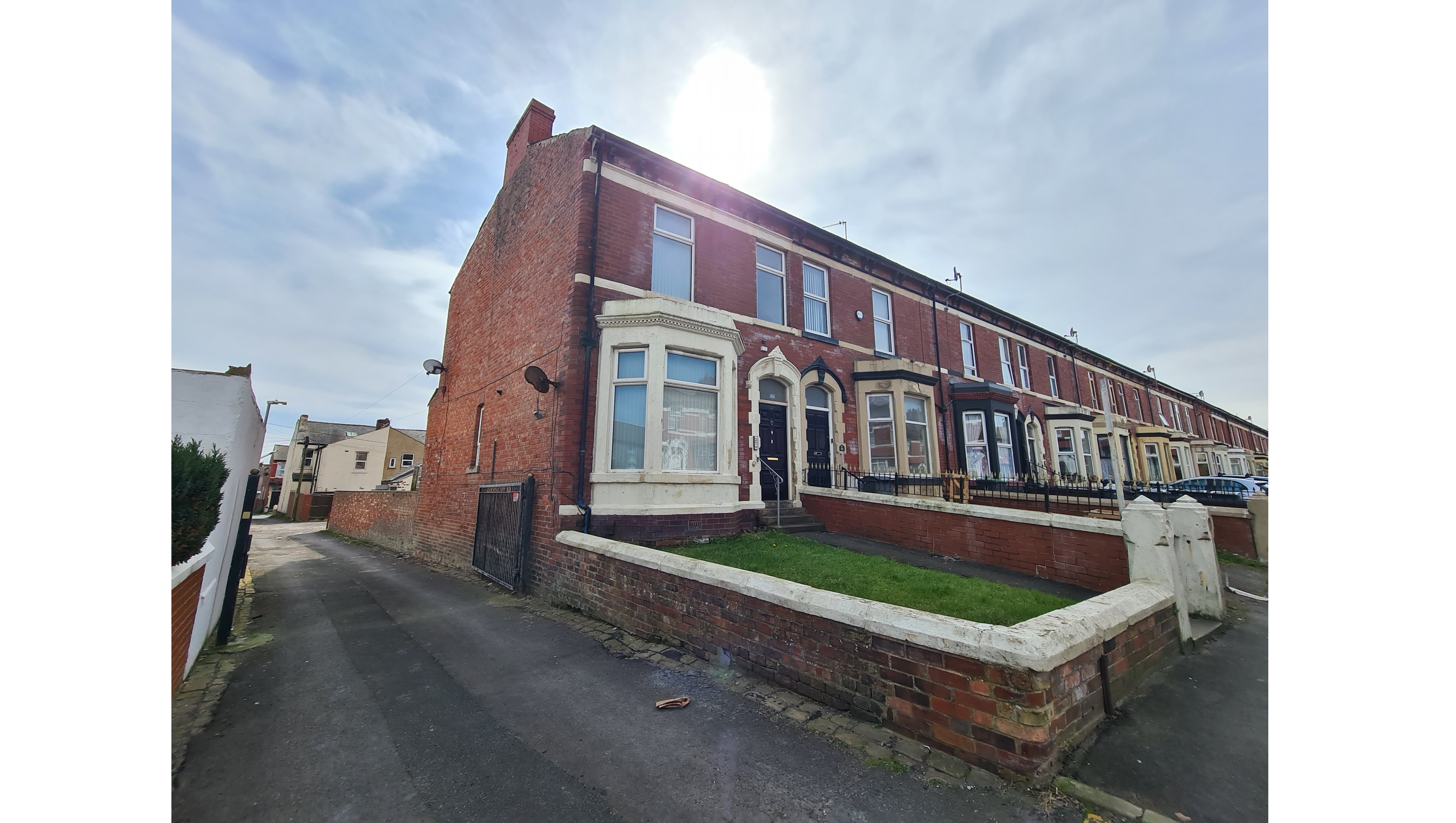 INVESTMENT - Freehold End of Terrace Building arranged to provide Three self contained Flats