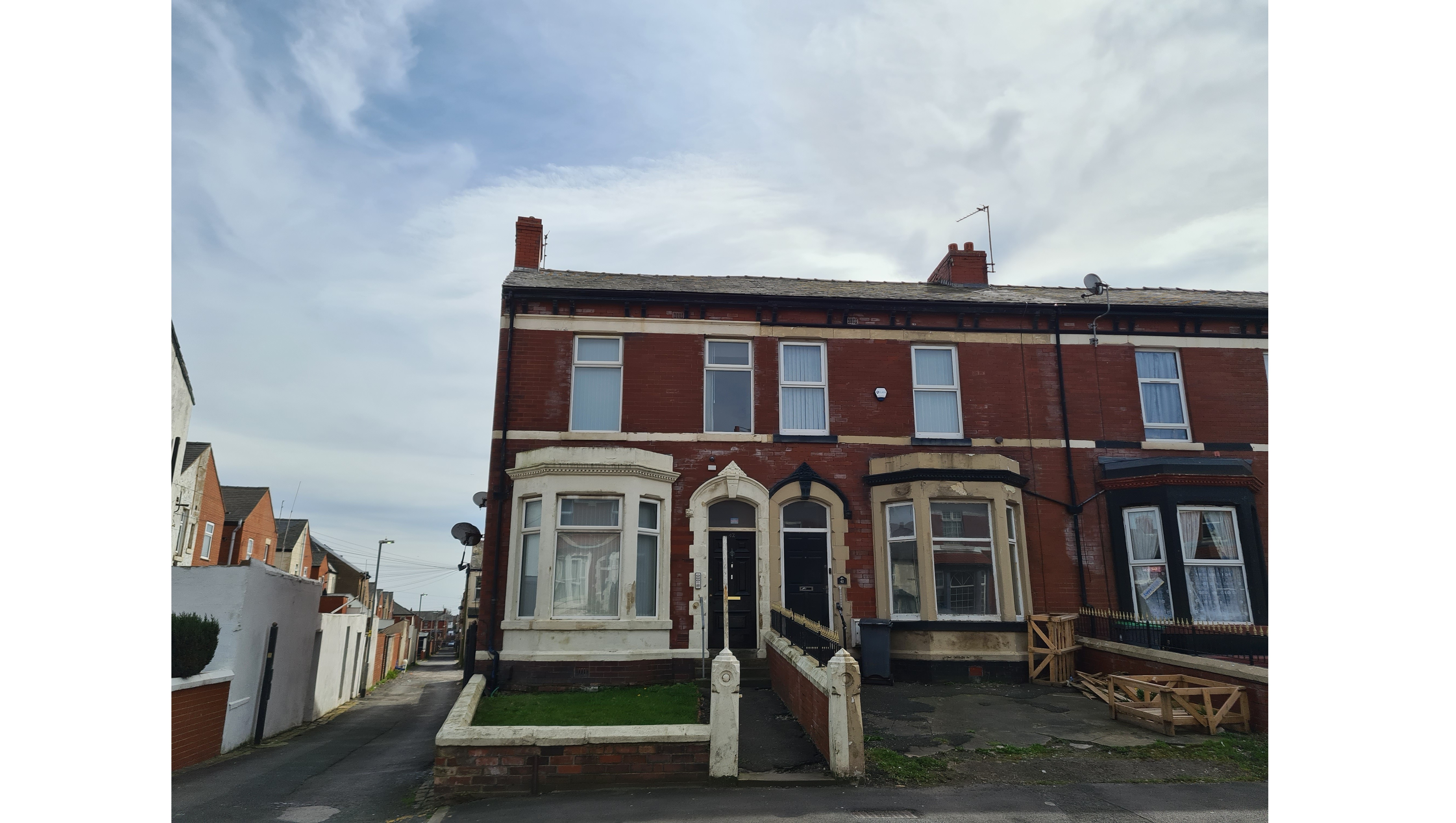 INVESTMENT - Freehold End of Terrace Building arranged to provide Three self contained Flats