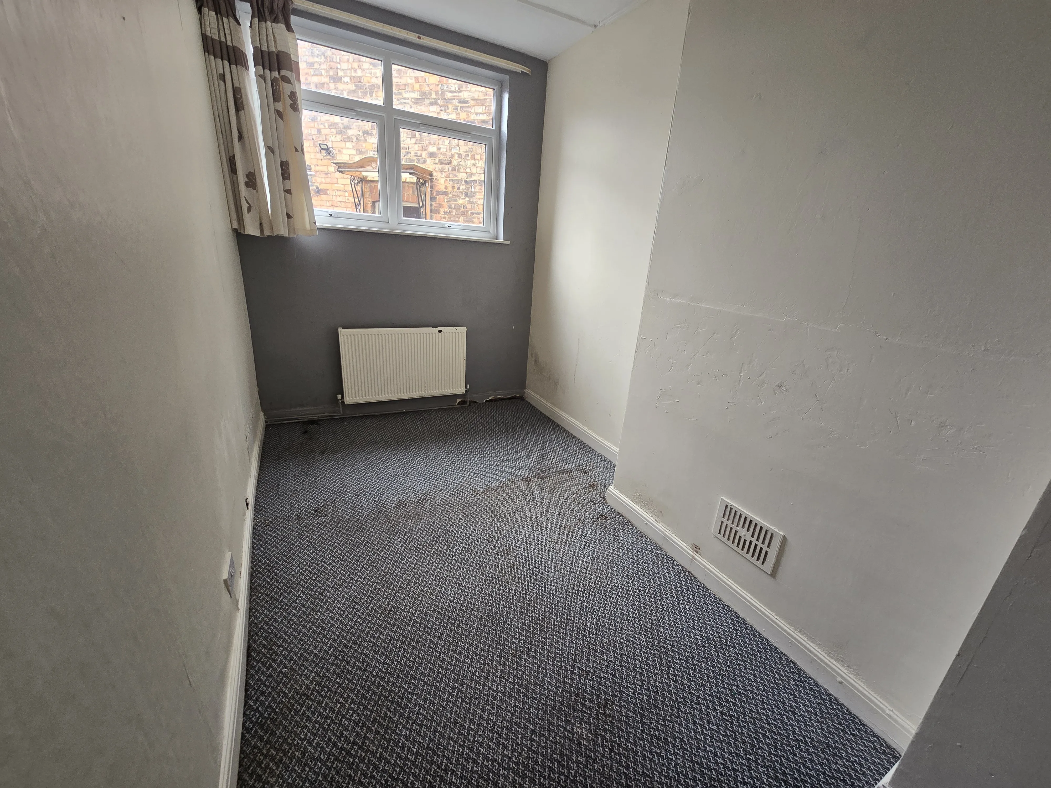 INVESTMENT/VACANT - Freehold Mid Terrace Building providing Four self contained Flats