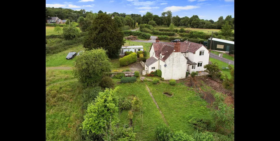 Two bedroom semi-detached stone cottage sitting within approximately two acres of grounds