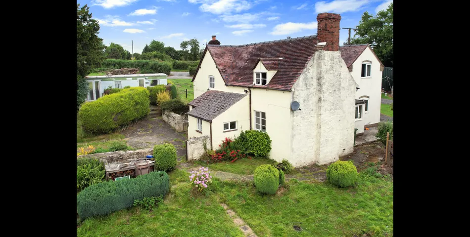 Two bedroom semi-detached stone cottage sitting within approximately two acres of grounds