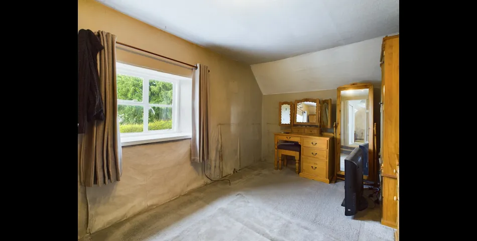 Two bedroom semi-detached stone cottage sitting within approximately two acres of grounds