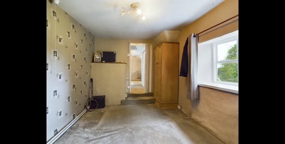 Two bedroom semi-detached stone cottage sitting within approximately two acres of grounds