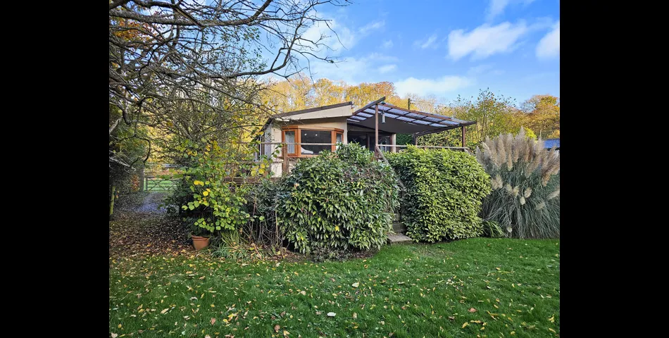Two bedroom riverside chalet built on stilts to prevent the risk of flooding