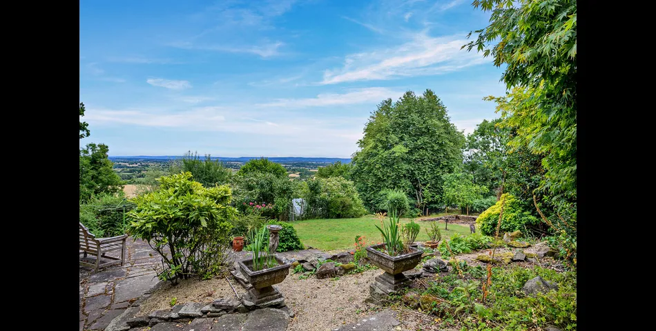 A three/four bedroom detached cottage in need of updating, occupying an elevated position looking over the Severn Valley