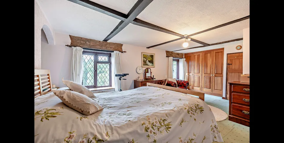 A three/four bedroom detached cottage in need of updating, occupying an elevated position looking over the Severn Valley
