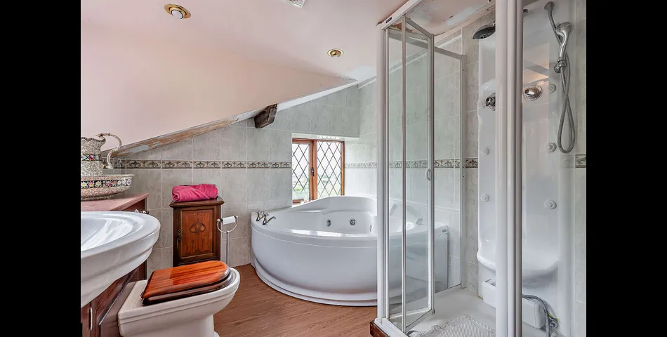 A three/four bedroom detached cottage in need of updating, occupying an elevated position looking over the Severn Valley