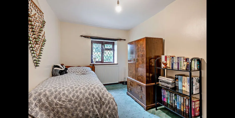 A three/four bedroom detached cottage in need of updating, occupying an elevated position looking over the Severn Valley