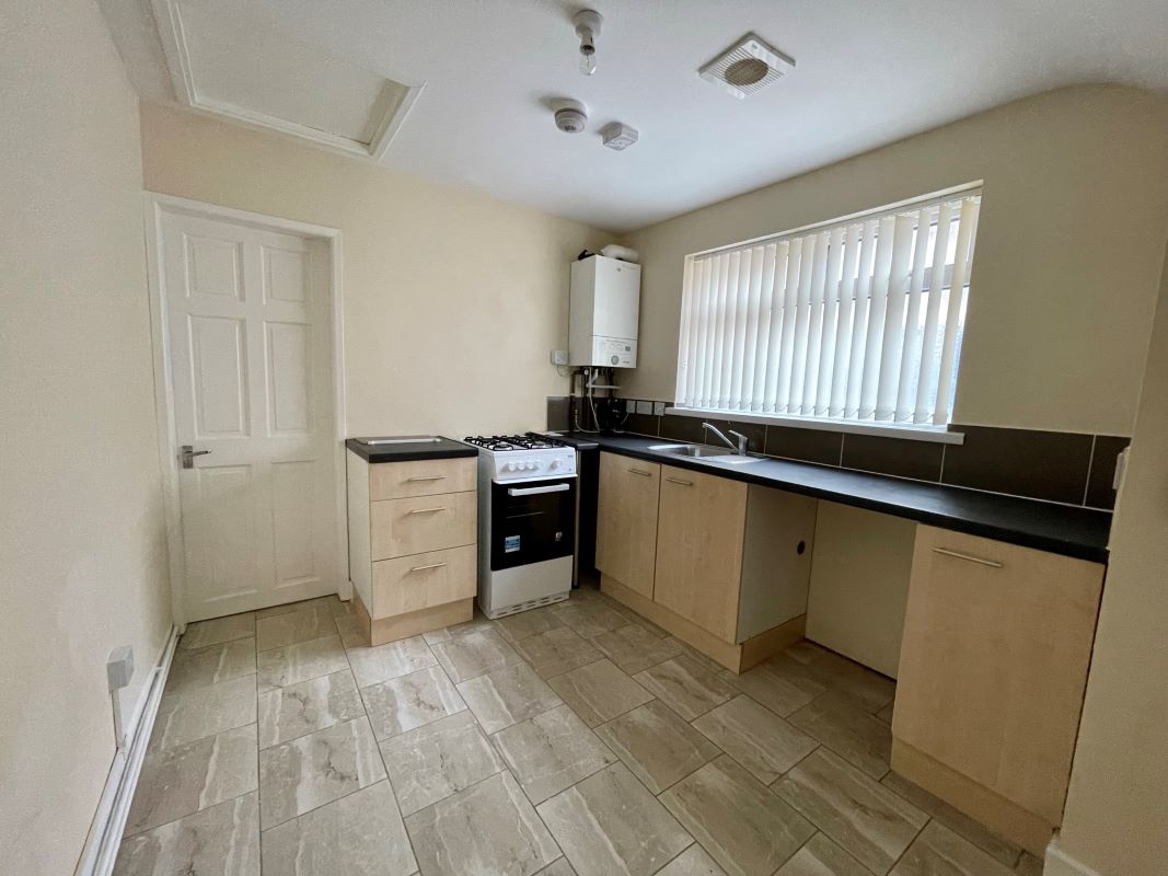 2 bedroom mid terraced house converted into two self-contained flats in Halesowen