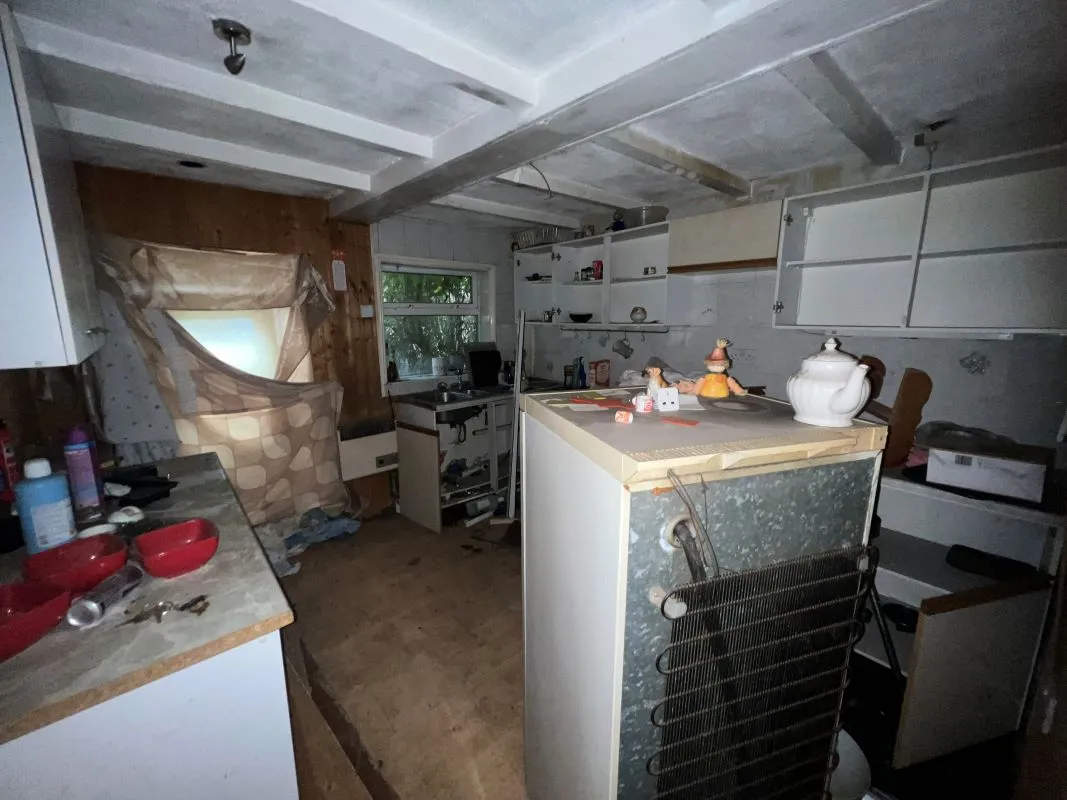 A vacant freehold three bedroom mid terraced property