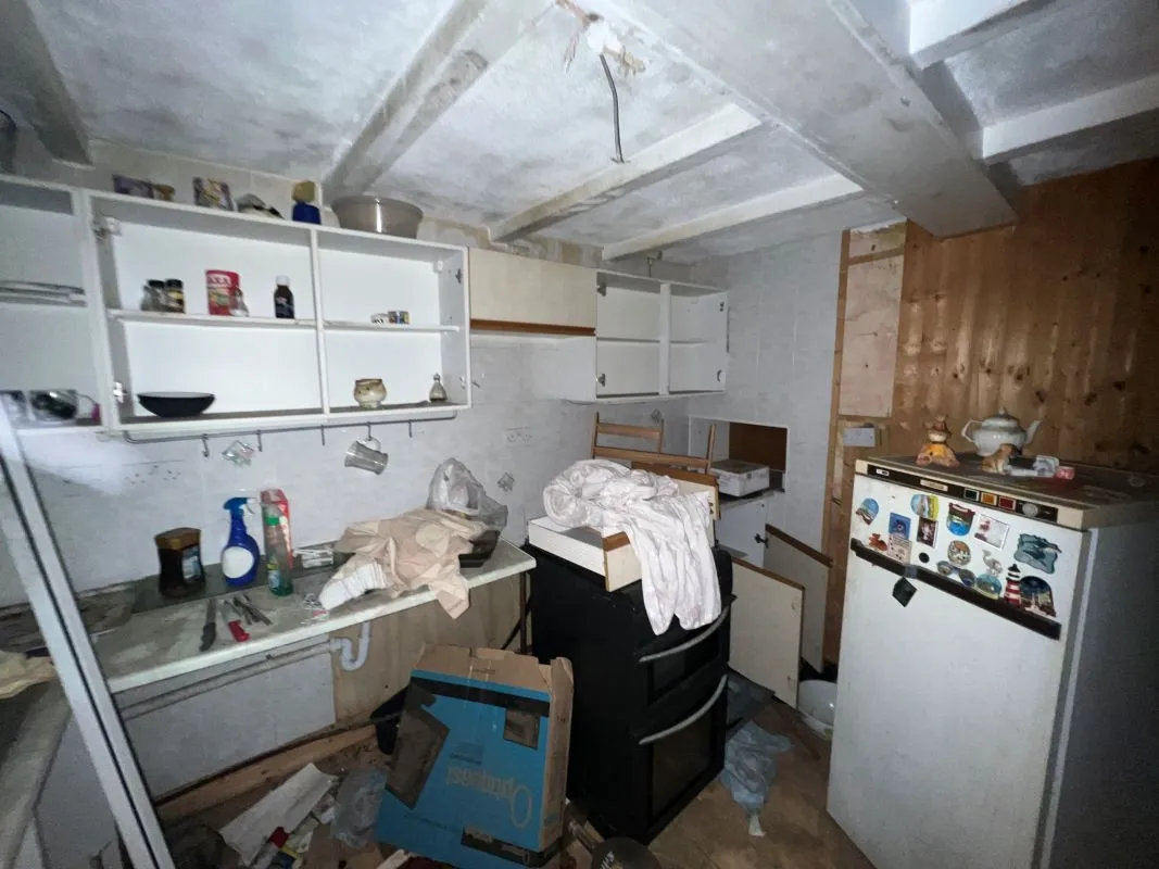 A vacant freehold three bedroom mid terraced property