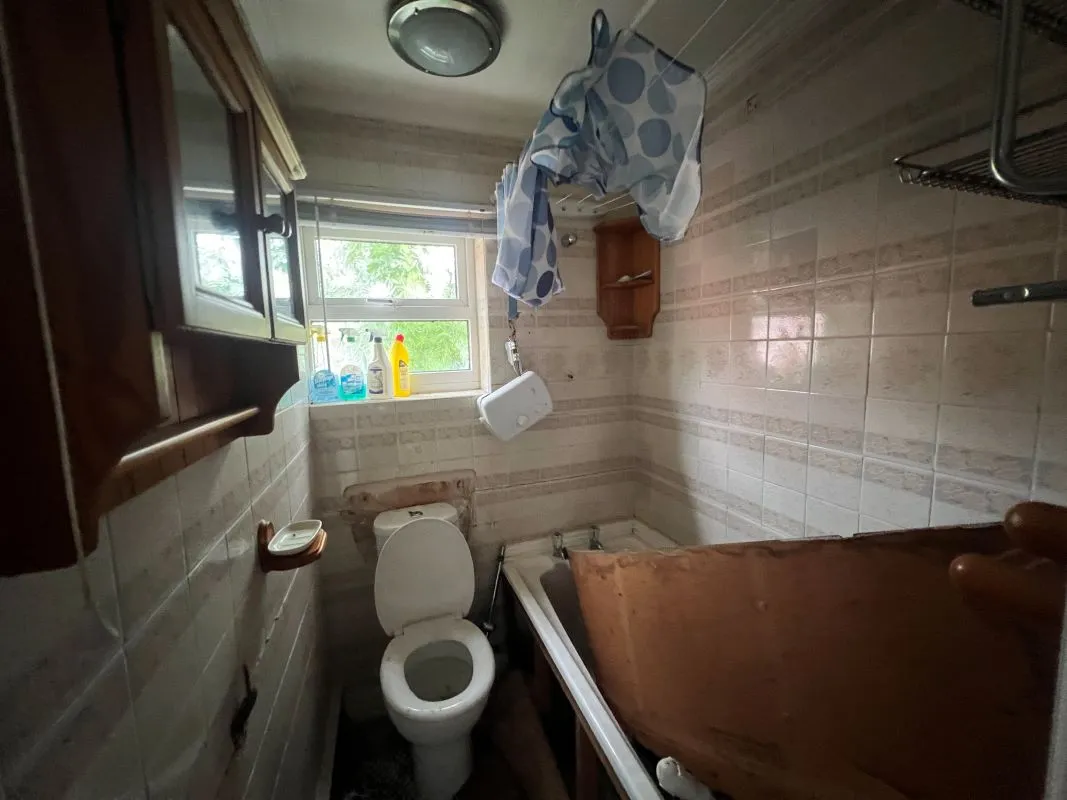 A vacant freehold three bedroom mid terraced property