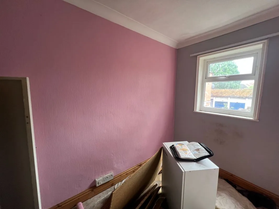 A vacant freehold three bedroom mid terraced property