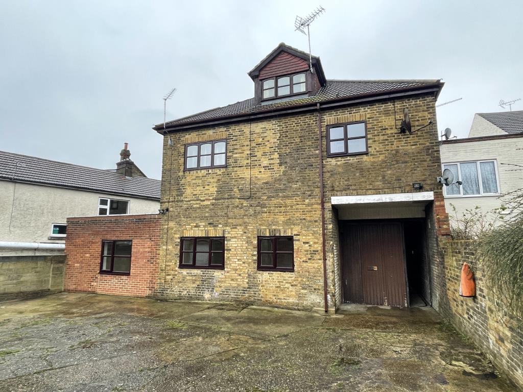Freehold Property Arranged As Four Flats With Further Conversion For Completion And Six Garages