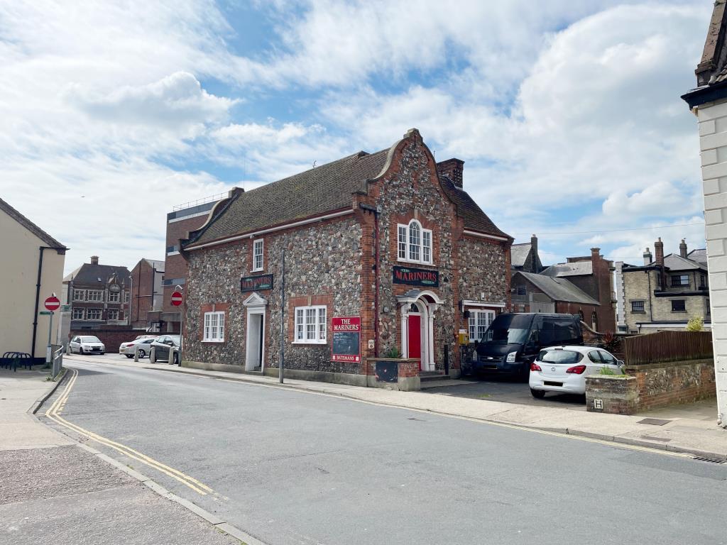 Pub With Courtyard Garden And Flat Above In Coastal Town