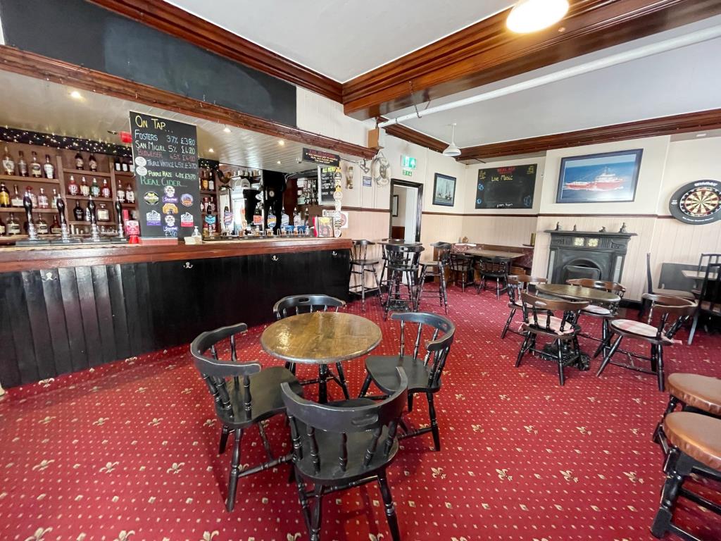 Pub With Courtyard Garden And Flat Above In Coastal Town