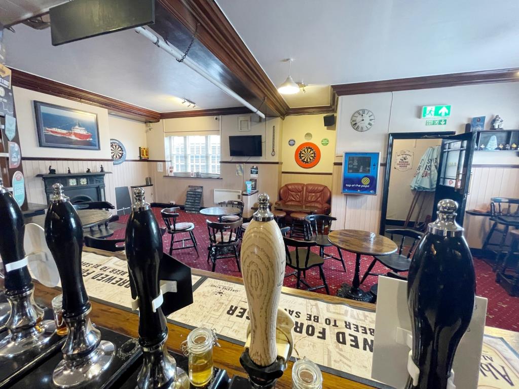 Pub With Courtyard Garden And Flat Above In Coastal Town