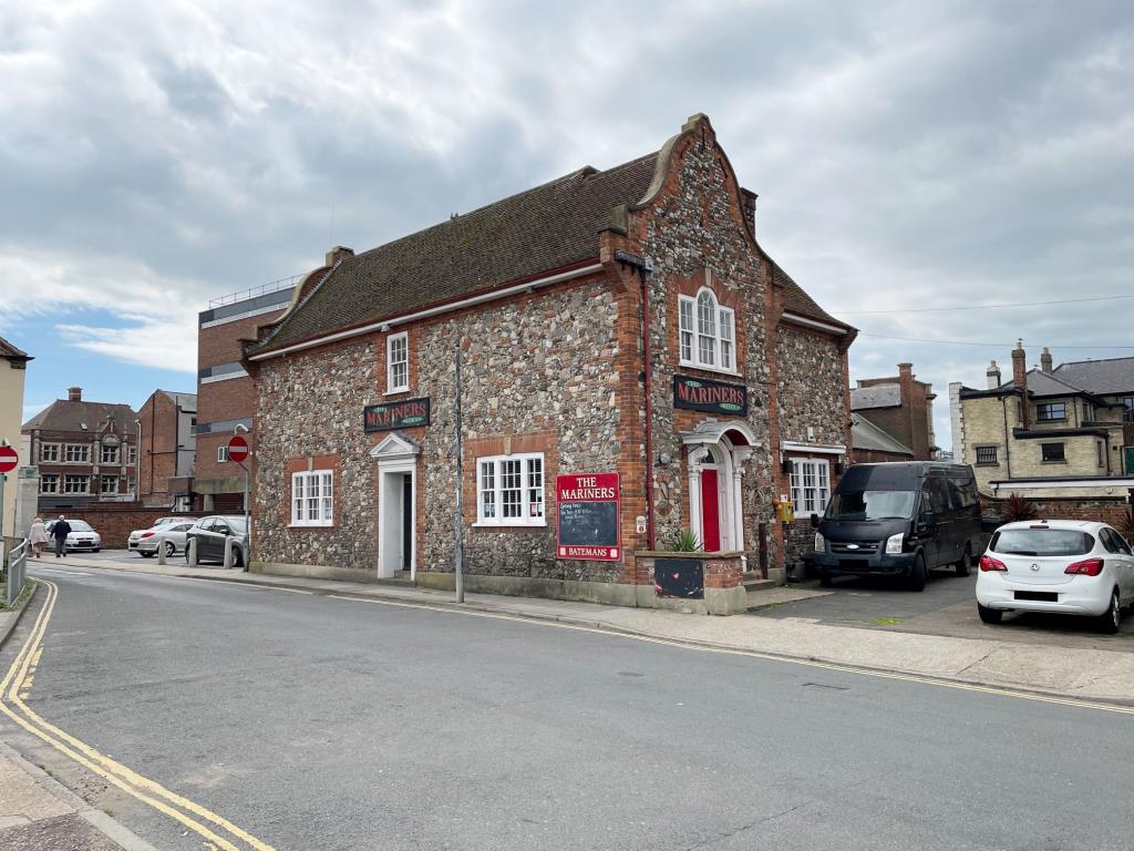 Pub With Courtyard Garden And Flat Above In Coastal Town