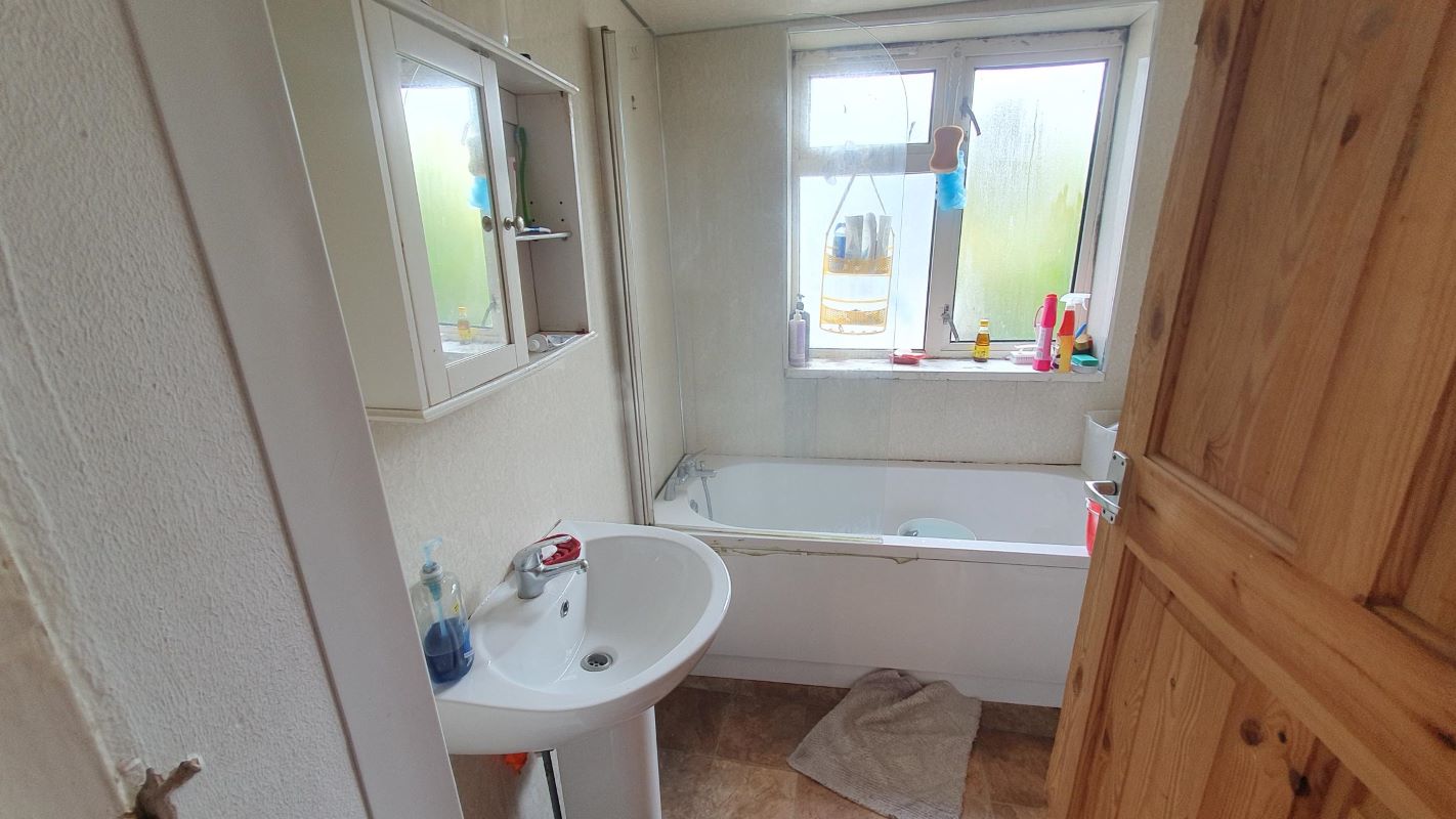 Freehold Investment Three Bedroom Mid-Terraced House
