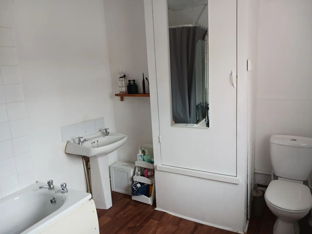 Freehold Investment - Retail Unit and Two Flats (Rental £22,200 per annum).