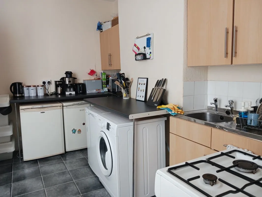 Freehold Investment - Retail Unit and Two Flats (Rental £22,200 per annum).