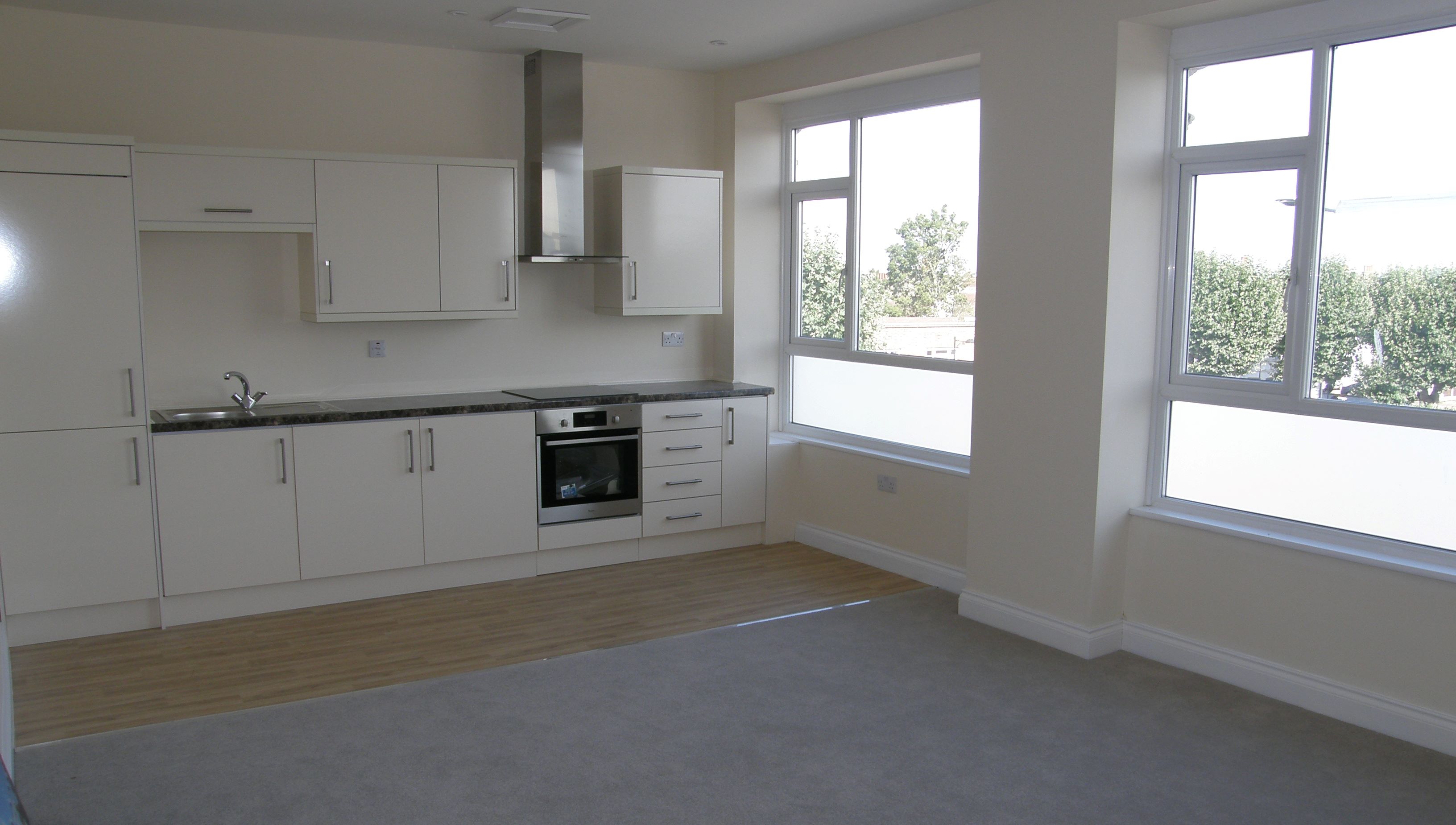 MIXED USE INVESTMENT OPPORTUNITY: A THREE STOREY BUILDING CLOSE TO SHOPS, COMPRISING 2 VACANT RETAIL UNITS THAT HAVE BEEN PARTIALLY UPDATED, TO THE FIRST AND SECOND FLOORS ARE 4 X VACANT REFURBISHED ONE BEDROOM FLATS.