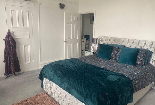 BUY TO LET INVESTMENT: A SPACIOUS TWO BEDROOM TWO BATHROOM FIRST FLOOR APARTMENT WITH LONG LEASE AND TENANT IN OCCUPATION.