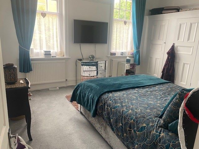 BUY TO LET INVESTMENT: A SPACIOUS TWO BEDROOM TWO BATHROOM FIRST FLOOR APARTMENT WITH LONG LEASE AND TENANT IN OCCUPATION.