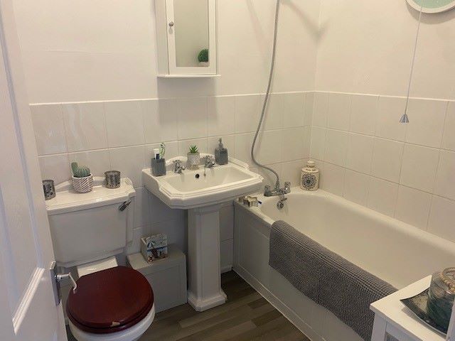BUY TO LET INVESTMENT: A SPACIOUS TWO BEDROOM TWO BATHROOM FIRST FLOOR APARTMENT WITH LONG LEASE AND TENANT IN OCCUPATION.