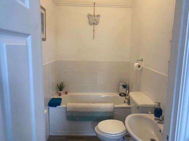 BUY TO LET INVESTMENT: A SPACIOUS TWO BEDROOM TWO BATHROOM FIRST FLOOR APARTMENT WITH LONG LEASE AND TENANT IN OCCUPATION.