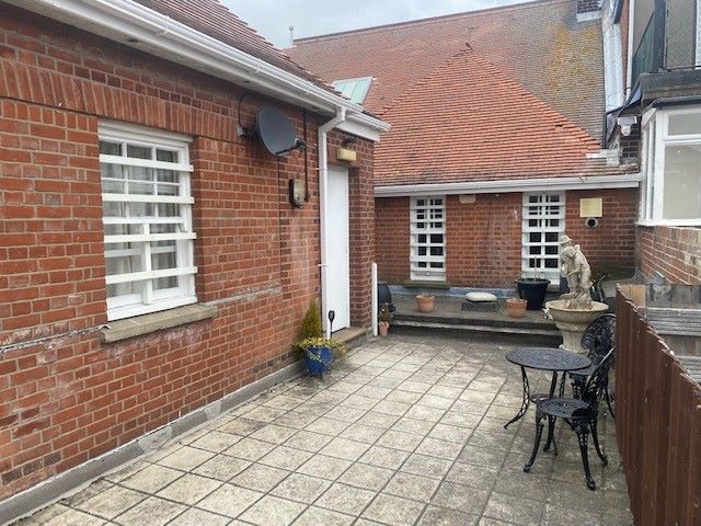 BUY TO LET INVESTMENT: A SPACIOUS TWO BEDROOM TWO BATHROOM FIRST FLOOR APARTMENT WITH LONG LEASE AND TENANT IN OCCUPATION.