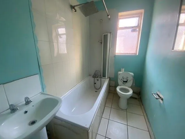 MIXED USE INVESTMENT: A PART LET DETACHED BUILDING WITH 2 GROUND FLOOR COMMERCIAL UNITS AND A RESIDENTIAL FLAT ABOVE AND BUILDERS YARD TO REAR