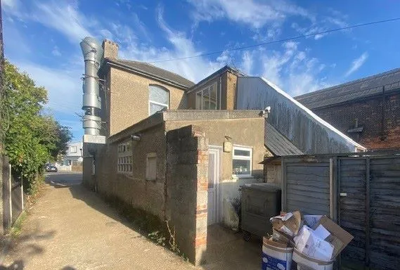 MIXED USE INVESTMENT: A PART LET DETACHED BUILDING WITH 2 GROUND FLOOR COMMERCIAL UNITS AND A RESIDENTIAL FLAT ABOVE AND BUILDERS YARD TO REAR