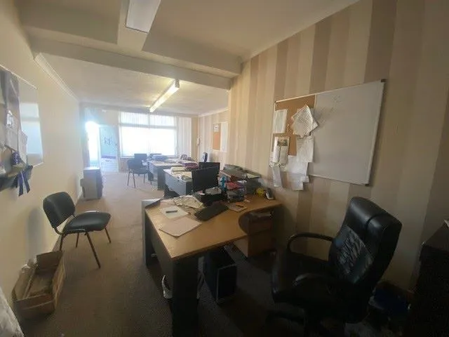 MIXED USE INVESTMENT: A PART LET DETACHED BUILDING WITH 2 GROUND FLOOR COMMERCIAL UNITS AND A RESIDENTIAL FLAT ABOVE AND BUILDERS YARD TO REAR