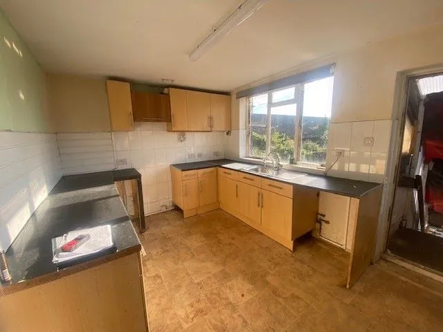 MIXED USE INVESTMENT: A PART LET DETACHED BUILDING WITH 2 GROUND FLOOR COMMERCIAL UNITS AND A RESIDENTIAL FLAT ABOVE AND BUILDERS YARD TO REAR