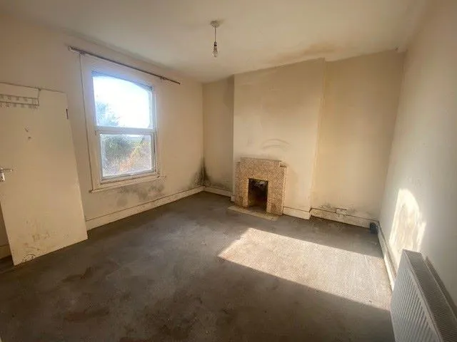 MIXED USE INVESTMENT: A PART LET DETACHED BUILDING WITH 2 GROUND FLOOR COMMERCIAL UNITS AND A RESIDENTIAL FLAT ABOVE AND BUILDERS YARD TO REAR