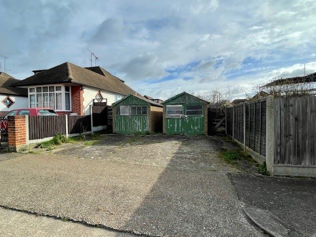 GARAGES / LAND INVESTMENT: A VACANT FREEHOLD SITE HOUSING TWO GARAGES / BUILDINGS IN NEED OF REPAIR / RENOVATION WITH ADDITIONAL LAND TO THE REAR 