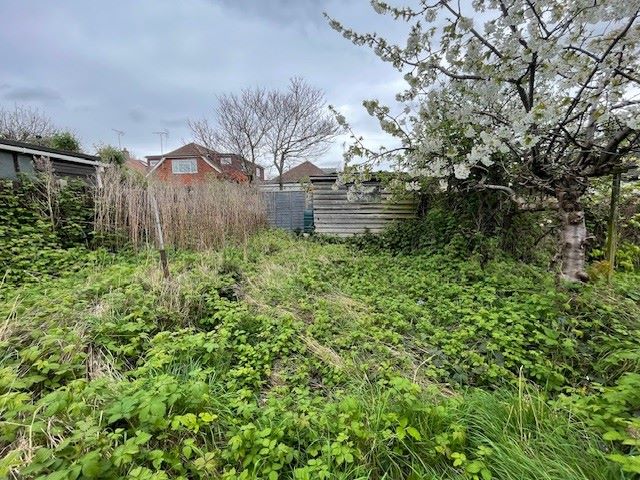 GARAGES / LAND INVESTMENT: A VACANT FREEHOLD SITE HOUSING TWO GARAGES / BUILDINGS IN NEED OF REPAIR / RENOVATION WITH ADDITIONAL LAND TO THE REAR 