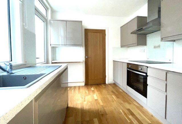 RESIDENTIAL INVESTMENT: A TWO BED GROUND FLOOR FLAT WITH RESIDENTS PARKING PLUS A LONG LEASE AND SHARED GARDEN LOCATED CLOSE TO THE RAILWAY STATION