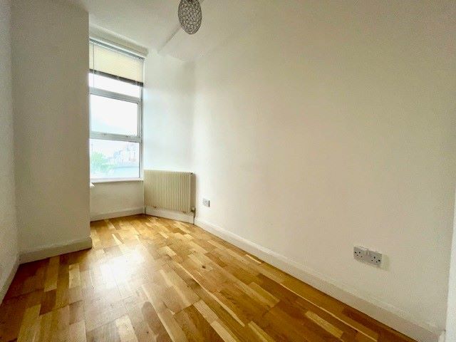 RESIDENTIAL INVESTMENT: A TWO BED GROUND FLOOR FLAT WITH RESIDENTS PARKING PLUS A LONG LEASE AND SHARED GARDEN LOCATED CLOSE TO THE RAILWAY STATION