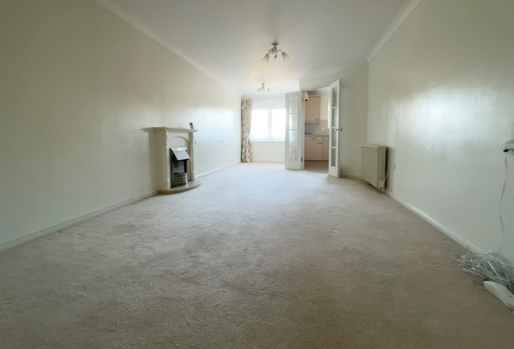 RESIDENTIAL INVESTMENT: A VACANT ONE BEDROOM SECOND FLOOR RETIREMENT APARTMENT CONSIDERED TO BE SUBSTANTIALLY BELOW CURRENT MARKET VALUE