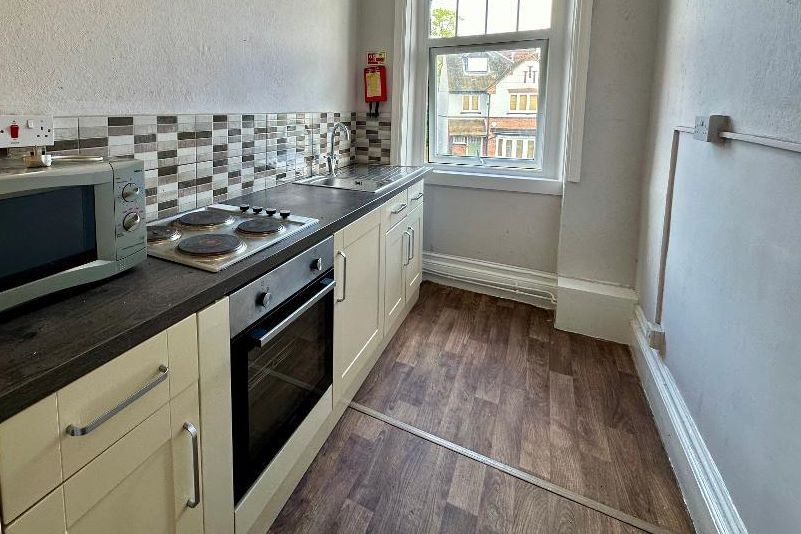 RESIDENTIAL INVESTMENT: A SUBSTANTIAL FREEHOLD BUILDING WITH CAR PARK USED AS A HOUSE OF MULTIPLE OCCUPANCY COMPRISING 9 STUDIOS AND 10 ROOMS