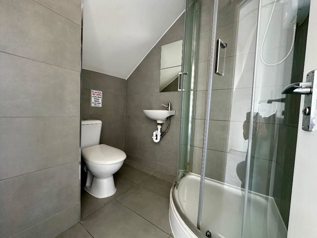 RESIDENTIAL INVESTMENT: A SUBSTANTIAL FREEHOLD BUILDING WITH CAR PARK USED AS A HOUSE OF MULTIPLE OCCUPANCY COMPRISING 9 STUDIOS AND 10 ROOMS