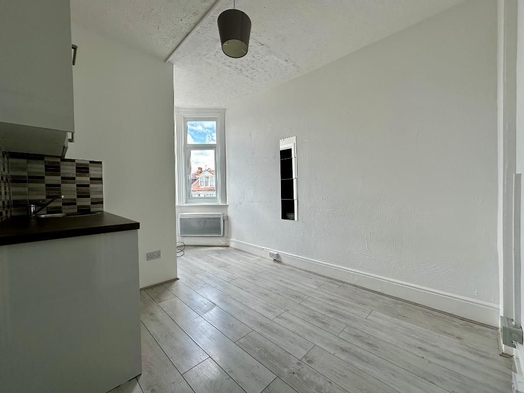RESIDENTIAL INVESTMENT: A SUBSTANTIAL FREEHOLD BUILDING WITH CAR PARK USED AS A HOUSE OF MULTIPLE OCCUPANCY COMPRISING 9 STUDIOS AND 10 ROOMS