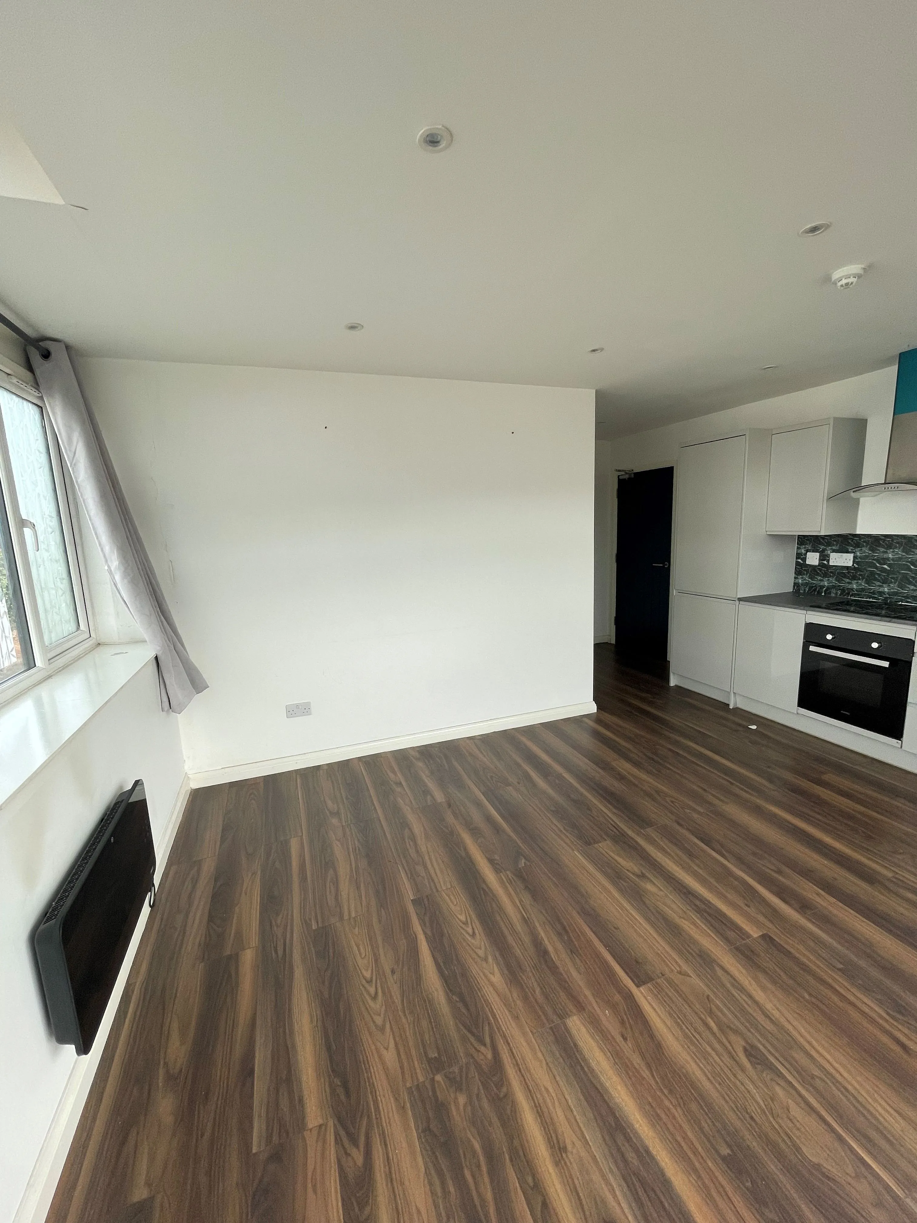 MIXED USE INVESTMENT OPPORTUNITY: A FREEHOLD PROPERTY COMPRISING TWO COMMERCIAL SHOPS WITH FIVE FLATS ABOVE AND CAR PARK TO THE REAR