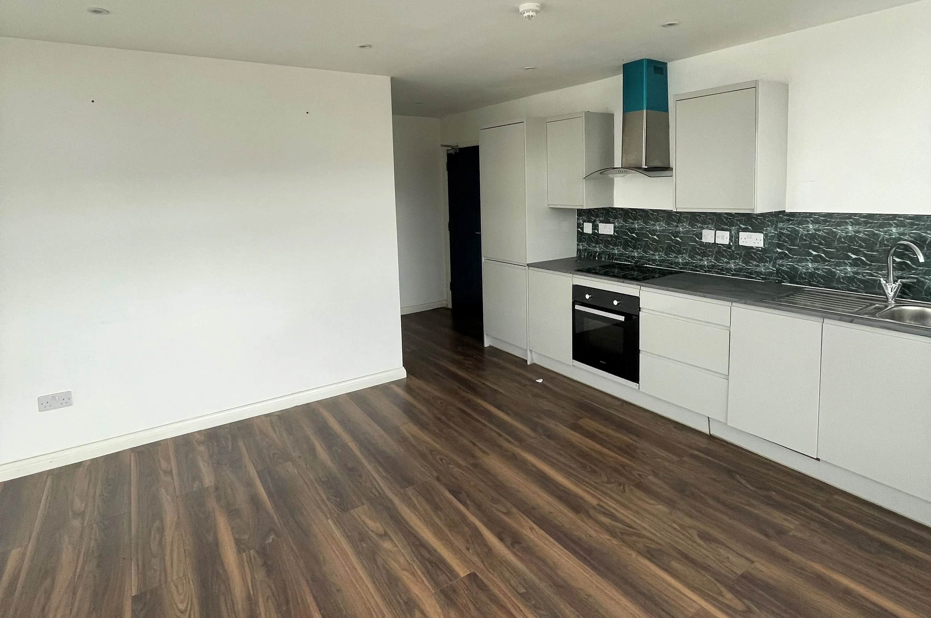 MIXED USE INVESTMENT OPPORTUNITY: A FREEHOLD PROPERTY COMPRISING TWO COMMERCIAL SHOPS WITH FIVE FLATS ABOVE AND CAR PARK TO THE REAR