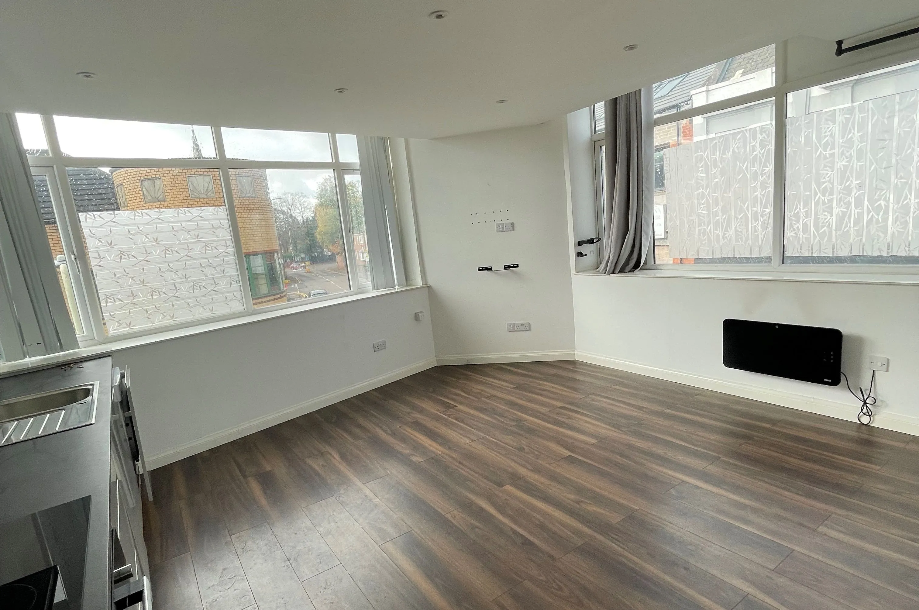 MIXED USE INVESTMENT OPPORTUNITY: A FREEHOLD PROPERTY COMPRISING TWO COMMERCIAL SHOPS WITH FIVE FLATS ABOVE AND CAR PARK TO THE REAR